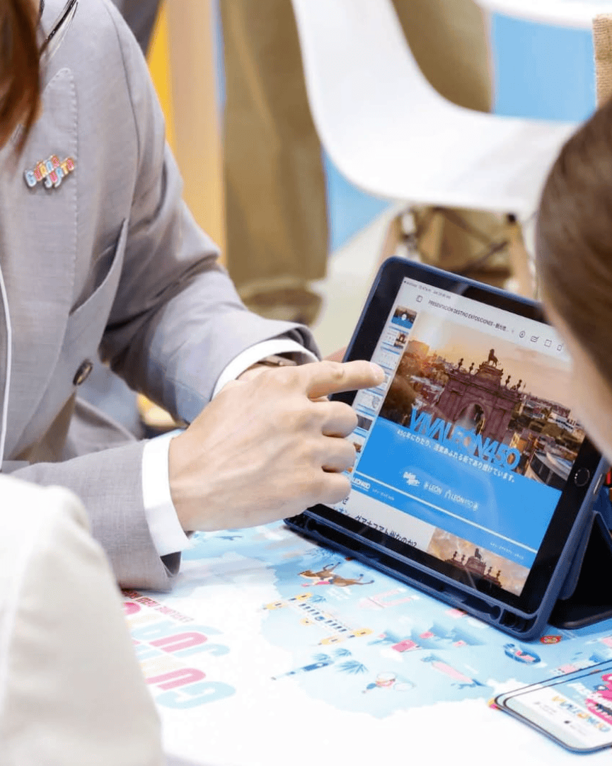 People at a business meeting using a tablet in León, Guanajuato, Mexico.