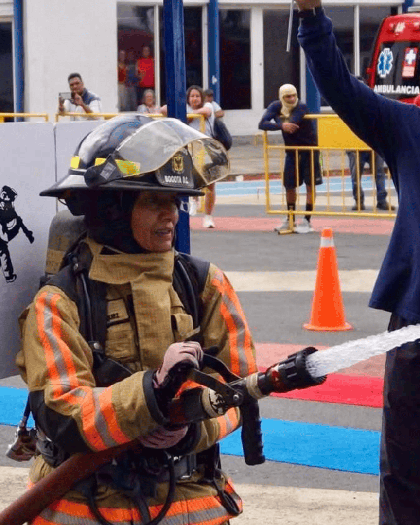 Firefighter in action during an international competition in León, Guanajuato, Mexico, demonstrating skills and teamwork.